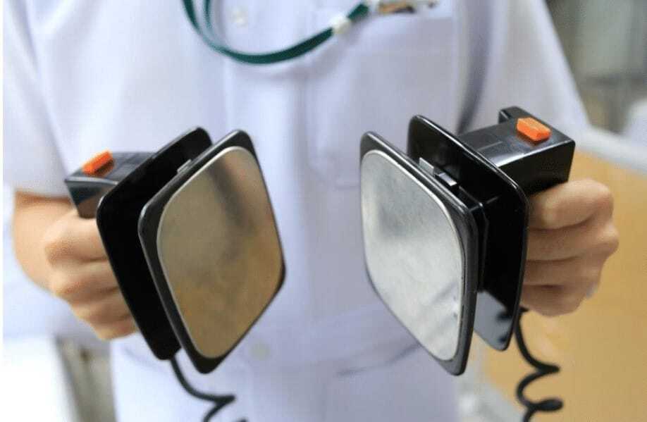 Person assuming defibrillator role.