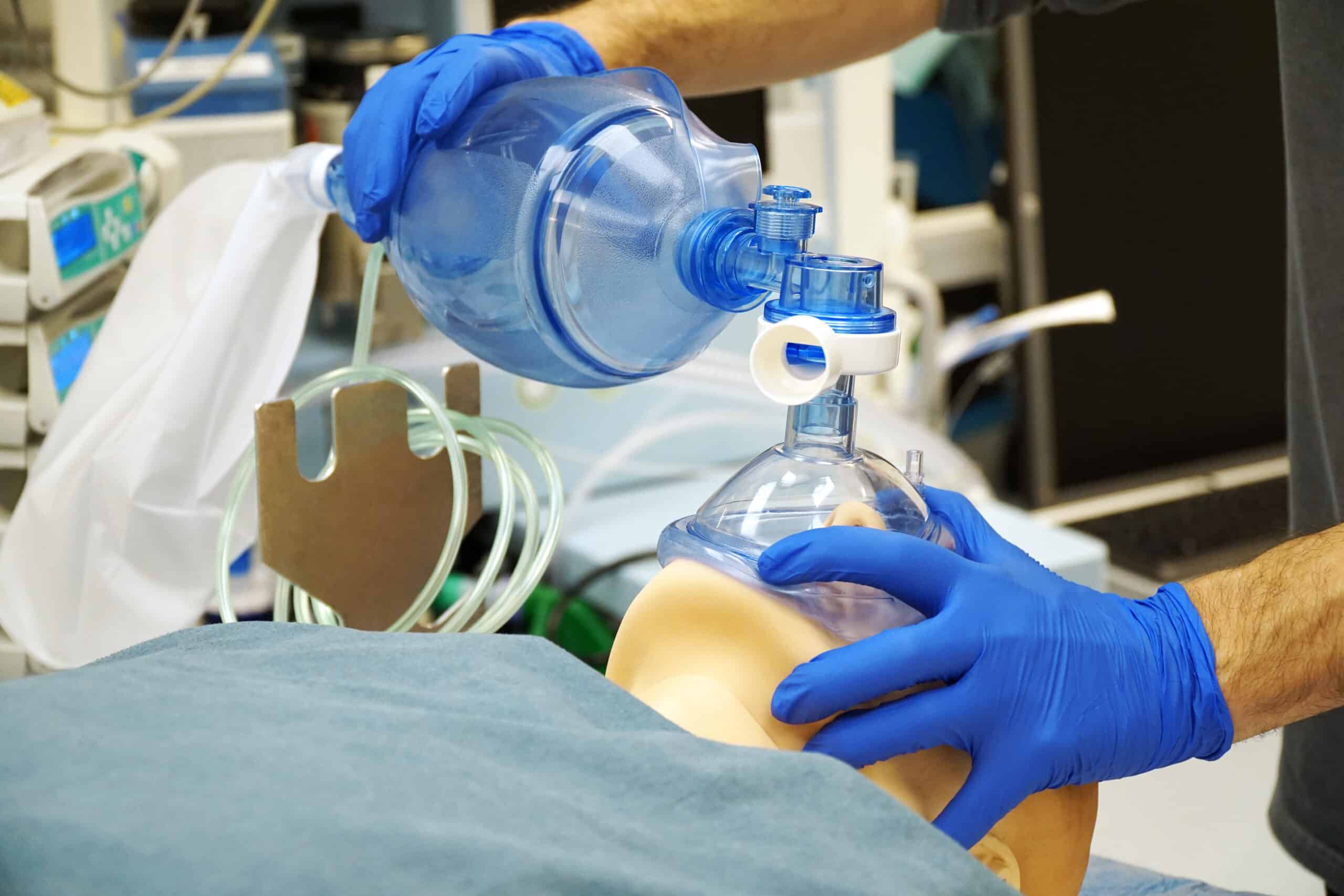 Rescuer providing positive pressure ventilation.