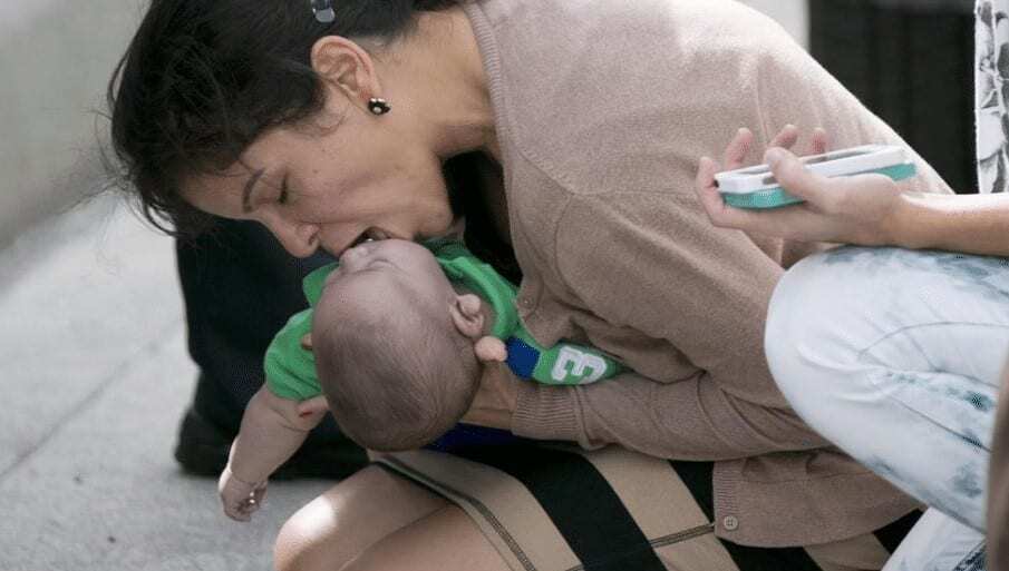 Rescuer-performs-infant-CPR.