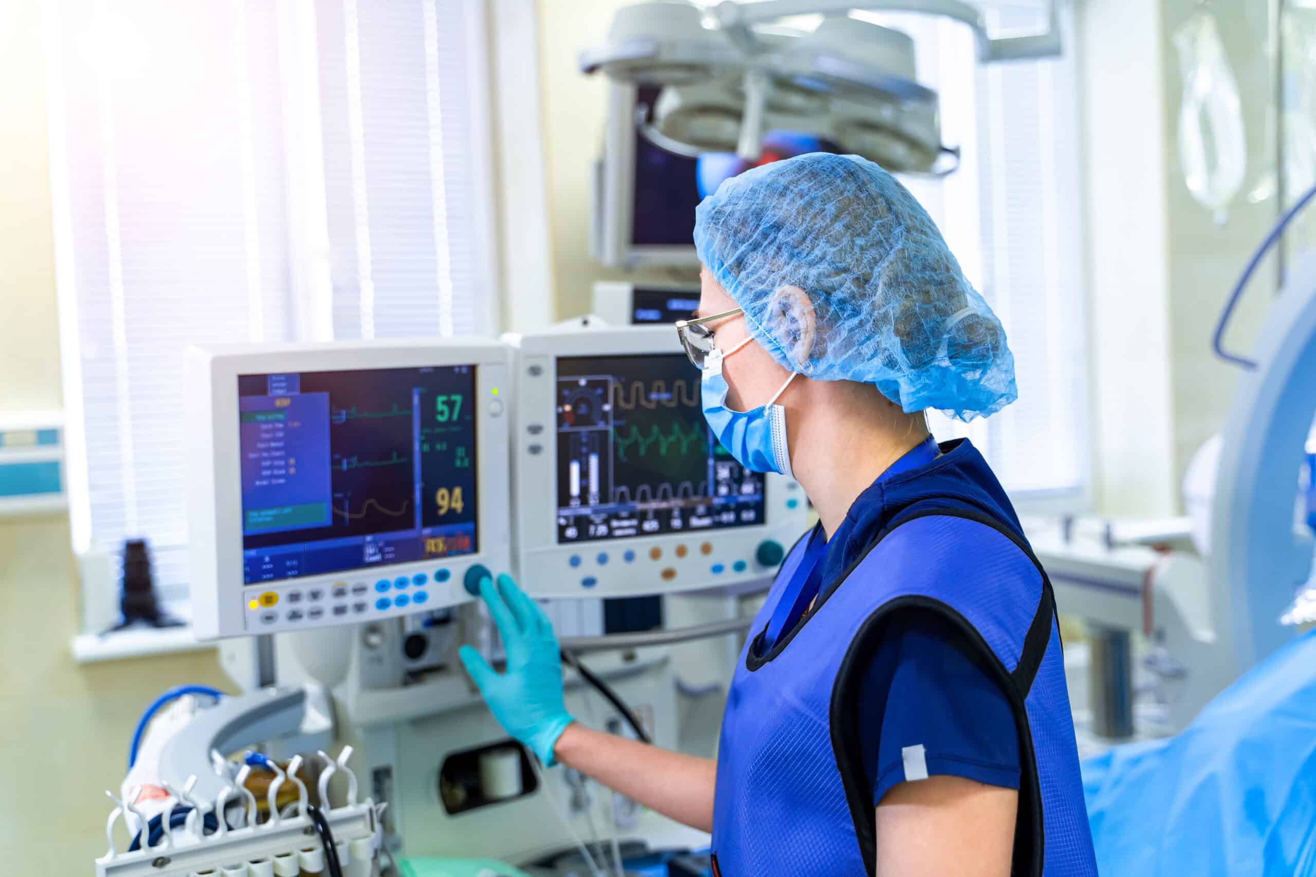 A provider adjusting a ventilator based on lung compliance.