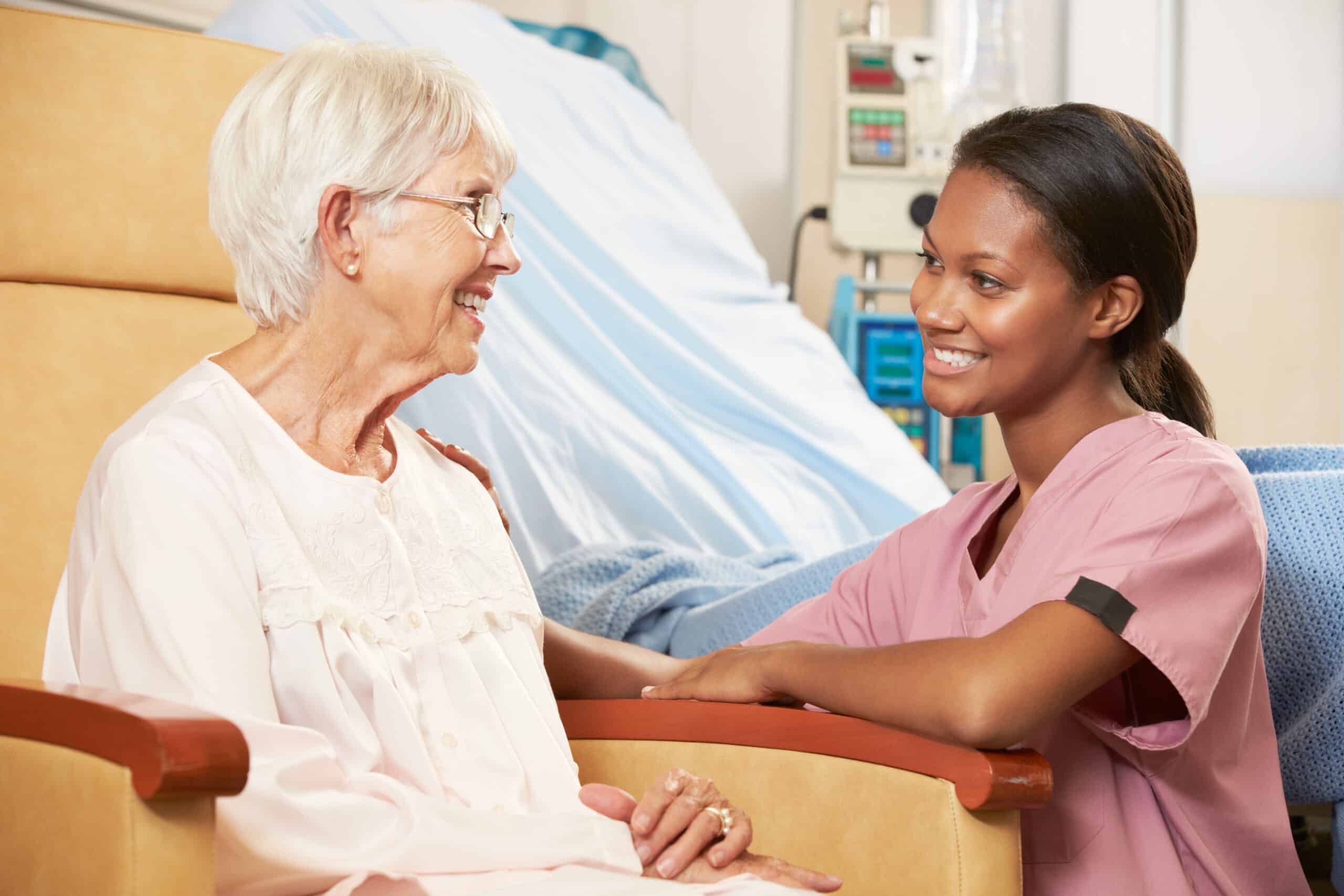 Health assessment is a general survey of the patient - female provider talking to a elderly female patient sitting in a chair.