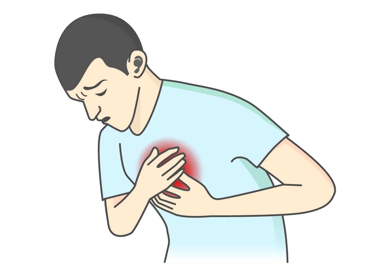 Man holding chest due to chest pain — symptom of acute coronary syndrome.