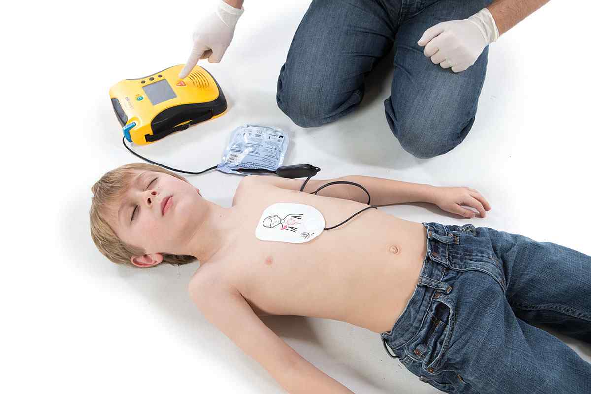 Child connected to defibrillator.