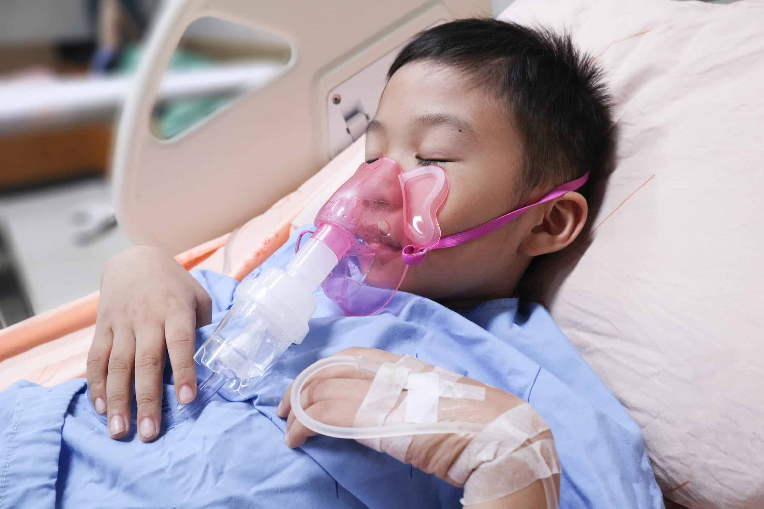 Child using nebulizer.