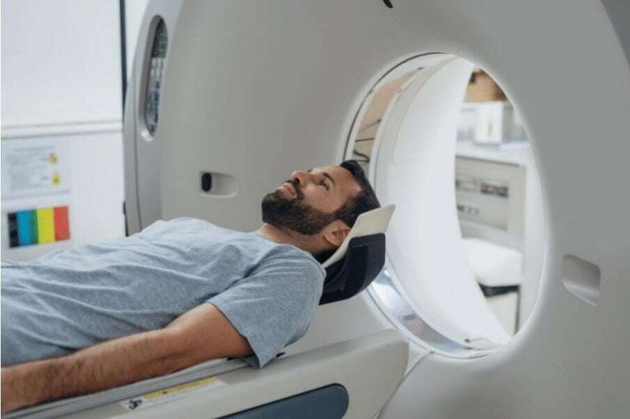 Patient Awaits CT Scan “Patient awaits CT scan.”