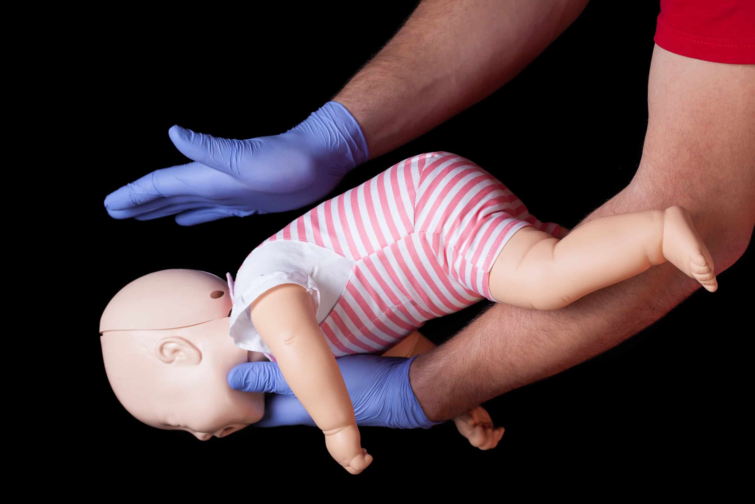 Back-slap position for choking infant.