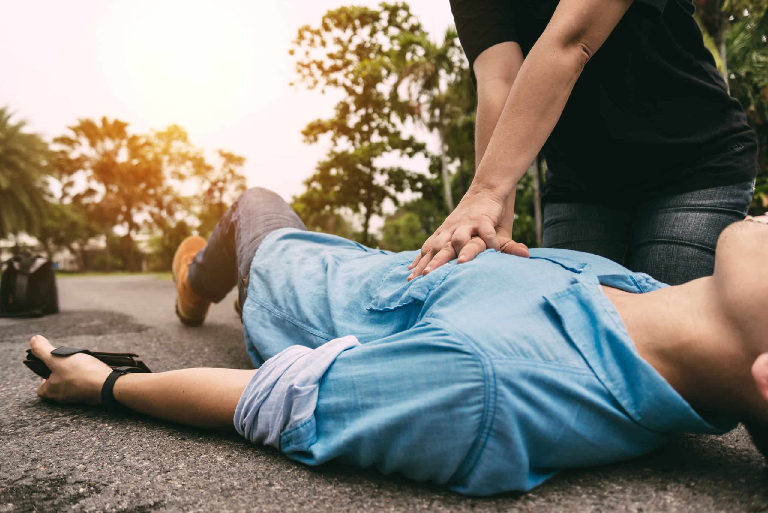Community member performing CPR.