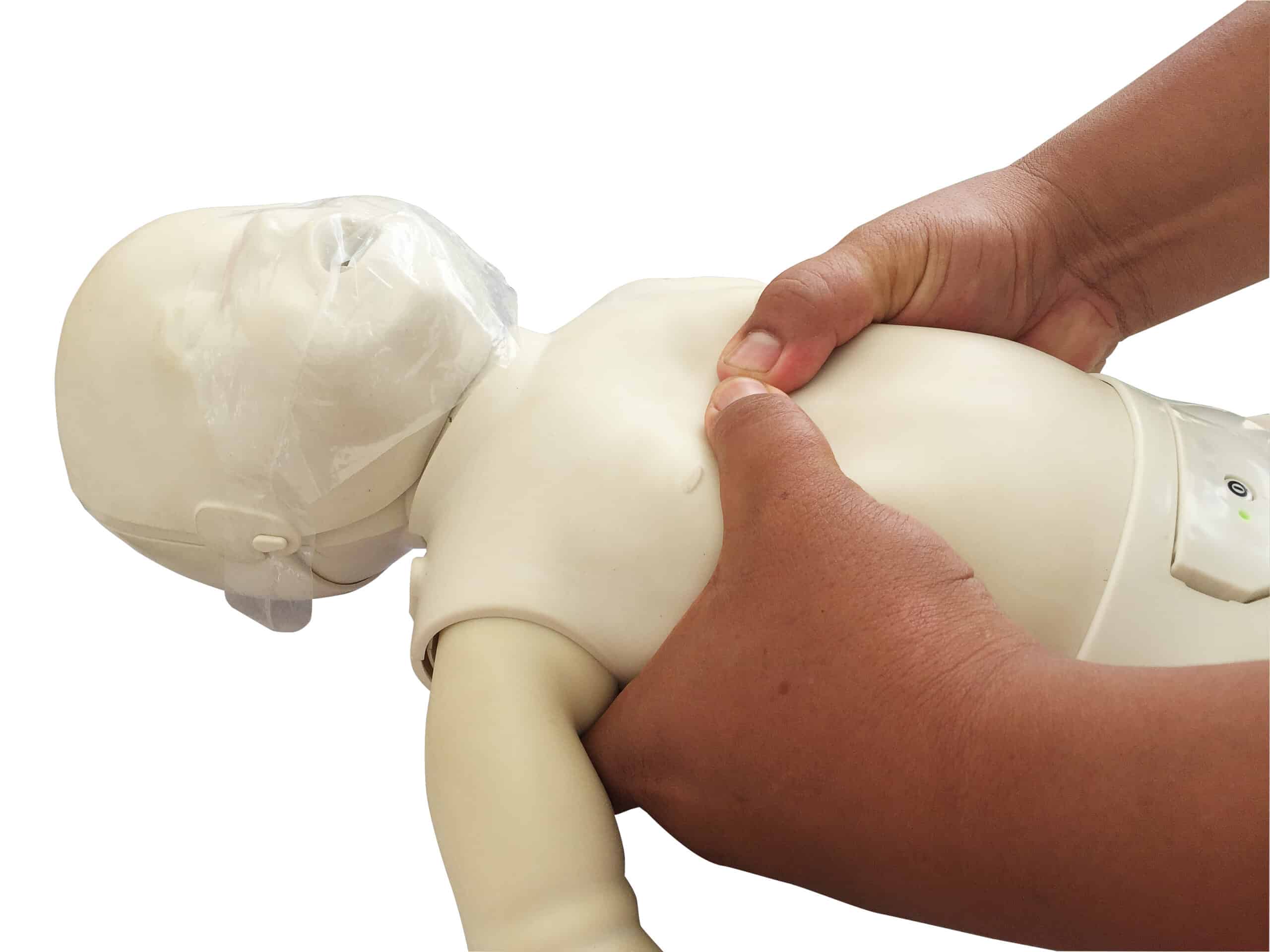 Thumbs pressing down on an infant’s chest demonstrating chest compressions.